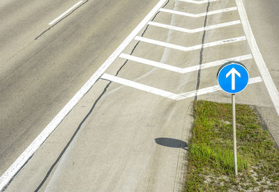 High angle view of arrow sign on road