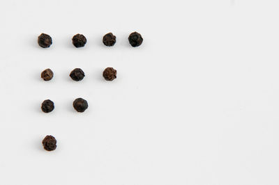 Full frame shot of small objects over white background