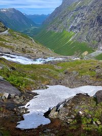 Scenic view of river amidst mountains