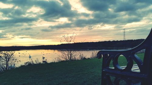 Scenic view of lake against cloudy sky
