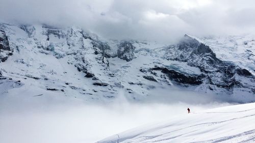 Scenic view of snowcapped mountain against sky