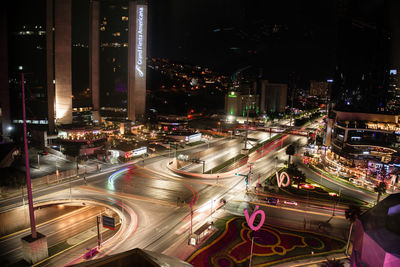 High angle view of illuminated city street at night