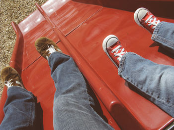 Low section of people sitting on seat