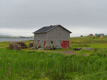 House on field against sky