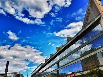 Low angle view of building against cloudy sky