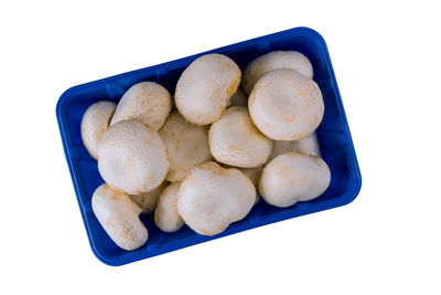 High angle view of eggs in container against white background