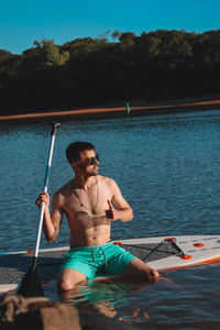 Rear view of man swimming in sea