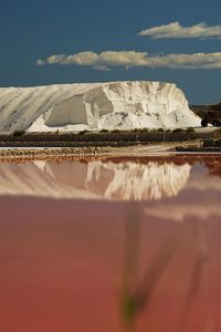 Scenic view of salt against sky