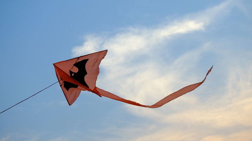 Low angle view of kite flying against sky