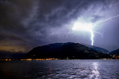 Lightning strike over the lake in zell am see, austria