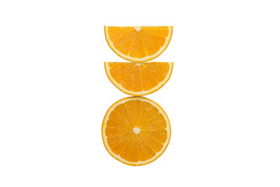 Close-up of orange slice against white background