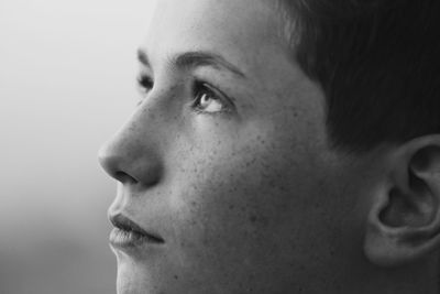 Close-up of thoughtful young man looking away