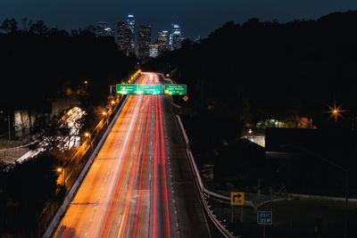 High angle view of light trails on road at night