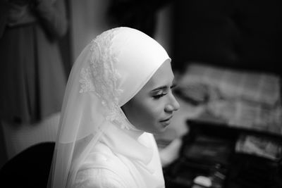 Close-up of young woman wearing mask