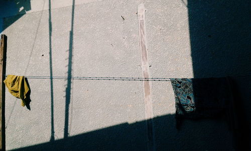 Rear view of man and woman standing on tiled floor