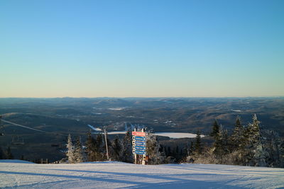 Scenic view of mountains against clear blue sky