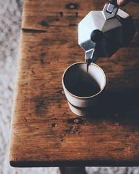 High angle view of coffee cup on table