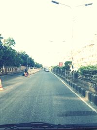 Road in city against sky