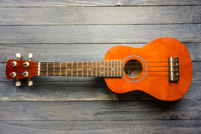 Close-up of guitar on table