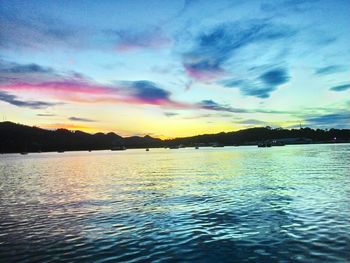 Scenic view of lake against dramatic sky