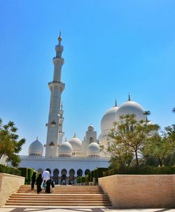 Low angle view of temple against clear blue sky