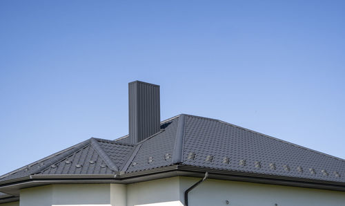 Low angle view of building against blue sky