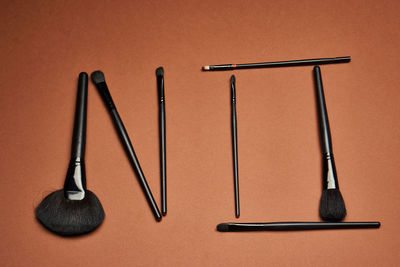 Make-up brushes on brown table