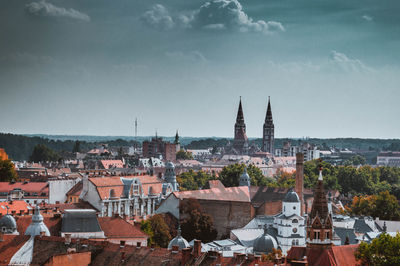 Townscape against cloudy sky