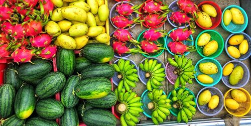 Vietnamese vendors selling summer fruits on street 