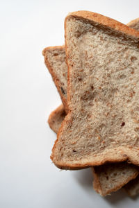 Close-up of bread against white background