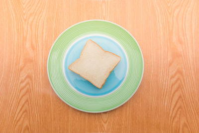 Directly above shot of bread in plate on table