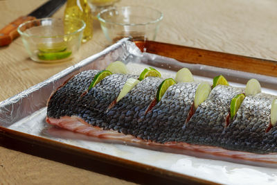 Close-up of fish in tray on table