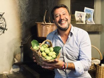 Portrait of a smiling young man in basket