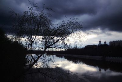 Scenic view of lake against cloudy sky