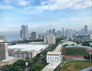 High angle view of buildings in city against sky