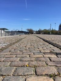 Cobblestone street against sky