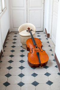 Orange paint on tiled floor