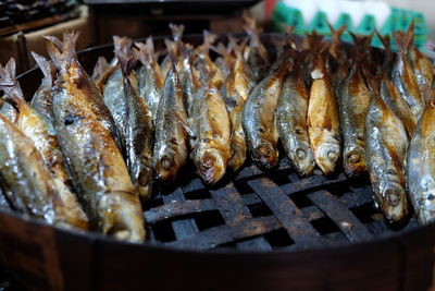 High angle view of fish on barbecue