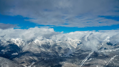 Scenic view of snowcapped mountains against sky