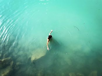 High angle view of man swimming in sea