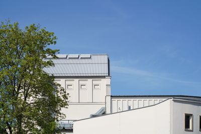 Low angle view of white building against clear sky