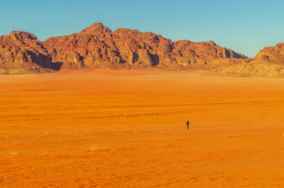 Scenic view of desert against clear sky