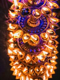 High angle view of illuminated candles in temple