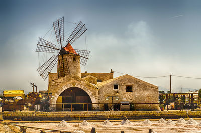 Old windmill for salt production in motya near trapani, sicily, italy