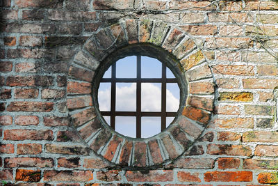 Arch window on brick wall of building