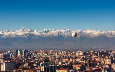 Aerial view of cityscape against clear sky