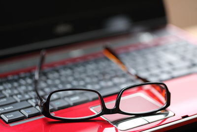 Close-up of eyeglasses on laptop