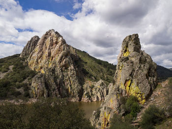 Scenic view of rocky mountains against sky