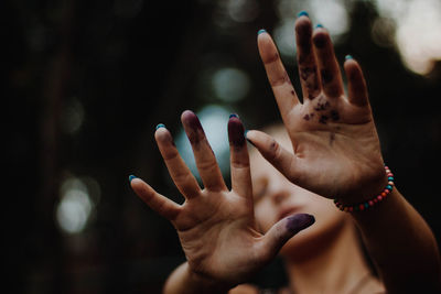 Close-up of woman hands gesturing outdoors