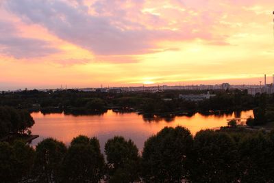 Scenic view of river at sunset